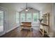Cozy breakfast nook features lots of natural light and a wooden dining table with bench seating at 3675 West Bay Dr, Sherrills Ford, NC 28673
