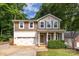 Charming two-story home with a welcoming front porch and well-maintained landscaping at 3675 West Bay Dr, Sherrills Ford, NC 28673