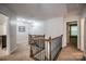 Upstairs hallway featuring decorative wood and iron railings at 3675 West Bay Dr, Sherrills Ford, NC 28673