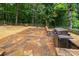 The backyard stone patio includes a grill at 3675 West Bay Dr, Sherrills Ford, NC 28673