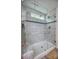 Bright shower features white and gray tile, a rainfall showerhead, and glass door at 3675 West Bay Dr, Sherrills Ford, NC 28673