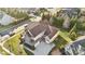 Beautiful aerial view of a home with a long driveway and lush landscaping in a quiet neighborhood at 401 Pecan Ridge Ct, Weddington, NC 28104