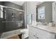 Contemporary bathroom design featuring a sleek glass shower and a white vanity at 401 Pecan Ridge Ct, Weddington, NC 28104