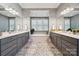 Bright bathroom with double vanity, large mirror, and soaking tub with a view at 401 Pecan Ridge Ct, Weddington, NC 28104