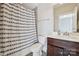 A clean bathroom shows the toilet and shower with patterned curtain at 401 Pecan Ridge Ct, Weddington, NC 28104