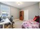 This cozy bedroom also features a desk with computer and bookshelf at 401 Pecan Ridge Ct, Weddington, NC 28104