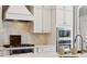 Close-up of kitchen appliances including a gas range, oven, microwave and tile backsplash at 401 Pecan Ridge Ct, Weddington, NC 28104