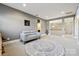 A living room has neutral walls, a decorative rug, and open stairway at 401 Pecan Ridge Ct, Weddington, NC 28104