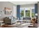 Comfortable living room with hardwood floors, a piano, and neutral paint at 401 Pecan Ridge Ct, Weddington, NC 28104