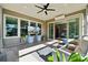 Relaxing sunroom with comfortable seating, large windows, and a ceiling fan at 401 Pecan Ridge Ct, Weddington, NC 28104