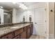 The bathroom features dual sinks, granite counters, and wood cabinets at 4224 Park South Station Blvd, Charlotte, NC 28210