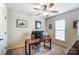 Bedroom features a ceiling fan, a desk with a computer, and a window at 4224 Park South Station Blvd, Charlotte, NC 28210