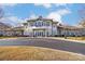 Beautiful clubhouse featuring a balcony, white trim, and manicured grounds offers a welcoming ambiance at 4224 Park South Station Blvd, Charlotte, NC 28210