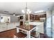 Open dining area features a wood table set and view to the living room and kitchen at 4224 Park South Station Blvd, Charlotte, NC 28210