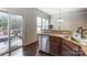 Kitchen area with granite countertops, stainless steel appliances, and access to the deck at 4224 Park South Station Blvd, Charlotte, NC 28210