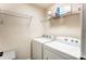 Laundry room with washer, dryer and metal shelving at 4224 Park South Station Blvd, Charlotte, NC 28210