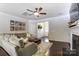 Inviting living room featuring dark floors, a gray couch, and white paint at 4224 Park South Station Blvd, Charlotte, NC 28210