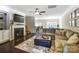 Cozy living room boasts a fireplace, dark floors, neutral paint, and lots of natural light at 4224 Park South Station Blvd, Charlotte, NC 28210