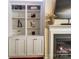 Comfortable living room with built-in shelving, a fireplace, and neutral decor at 4224 Park South Station Blvd, Charlotte, NC 28210