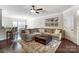 Inviting living room features dark floors, a gray couch, and a large ottoman at 4224 Park South Station Blvd, Charlotte, NC 28210