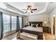 Spacious main bedroom with tray ceiling, a ceiling fan, and lots of natural light at 4224 Park South Station Blvd, Charlotte, NC 28210