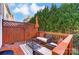 Outdoor patio with seating and privacy provided by mature landscaping at 4224 Park South Station Blvd, Charlotte, NC 28210