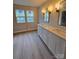Modern bathroom featuring a double sink vanity with updated lighting, providing a functional and stylish space at 44389 Us 52 N Hwy, Richfield, NC 28137