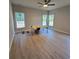 Bright bedroom featuring three windows offering serene views, complemented by a modern ceiling fan at 44389 Us 52 N Hwy, Richfield, NC 28137