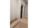 Inviting entryway featuring a built-in bench, contrasting door and modern trim work at 44389 Us 52 N Hwy, Richfield, NC 28137