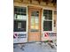 Exterior of the home under construction featuring a wood front door, framed by windows at 44389 Us 52 N Hwy, Richfield, NC 28137