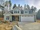 Charming two-story home featuring a spacious two-car garage and craftsman-style architecture at 44389 Us 52 N Hwy, Richfield, NC 28137