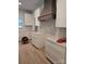 Modern kitchen featuring a stylish vent hood, lots of storage, and ample countertop space at 44389 Us 52 N Hwy, Richfield, NC 28137