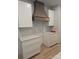 Well-lit kitchen area featuring modern cabinets, countertop space, and a stylish range hood at 44389 Us 52 N Hwy, Richfield, NC 28137