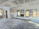 Spacious living room featuring newly installed drywall, fireplace, and natural light from multiple windows at 44389 Us 52 N Hwy, Richfield, NC 28137