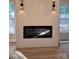 Modern living room featuring a sleek fireplace and stylish sconces, creating a cozy atmosphere at 44389 Us 52 N Hwy, Richfield, NC 28137