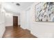 Well-lit hallway with hardwood floors, an elevator, wall trim and neutral paint at 4527 Gaynor Rd # 107, Charlotte, NC 28211