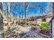 Beautiful backyard with a brick patio, outdoor seating, and lush landscaping, creating an inviting outdoor space at 5011 Tara Tea Dr, Tega Cay, SC 29708