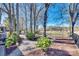 Expansive backyard featuring manicured landscaping, mature trees, and a fenced perimeter, offering privacy and beauty at 5011 Tara Tea Dr, Tega Cay, SC 29708
