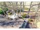 A charming backyard with a gazebo, landscaping, a small outbuilding, and a partial view of the roof at 5011 Tara Tea Dr, Tega Cay, SC 29708