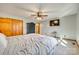 Bedroom features a ceiling fan, closet, carpet, and wall-mounted TV at 5011 Tara Tea Dr, Tega Cay, SC 29708
