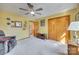 Comfortable bedroom with carpet flooring, a ceiling fan, closet and ample natural light at 5011 Tara Tea Dr, Tega Cay, SC 29708