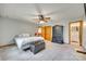 Bedroom with a ceiling fan, neutral carpet, large closet, and a comfortable decor at 5011 Tara Tea Dr, Tega Cay, SC 29708