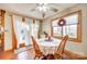 Bright breakfast nook featuring wood floors, view of the back yard, and an adjacent sliding glass door at 5011 Tara Tea Dr, Tega Cay, SC 29708