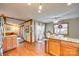 Open concept kitchen with wood floors, a breakfast nook, granite countertops, and views to the living room at 5011 Tara Tea Dr, Tega Cay, SC 29708