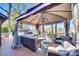 Relaxing patio with comfortable seating under a large gazebo, perfect for outdoor entertainment at 5011 Tara Tea Dr, Tega Cay, SC 29708