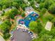 Aerial view of a colorful community playground, parking area, and a basketball court surrounded by trees at 5011 Tara Tea Dr, Tega Cay, SC 29708