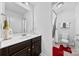 Well-lit bathroom with a sink, decorative towels, large mirror and walk-in shower at 5041 Wakehurst St, Kannapolis, NC 28081