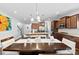 A spacious kitchen with wood cabinets, stainless steel appliances, granite countertops, and pendant lights at 5041 Wakehurst St, Kannapolis, NC 28081