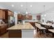 Spacious kitchen with stainless steel appliances, granite countertops, and an island with seating at 5041 Wakehurst St, Kannapolis, NC 28081