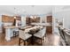 Large kitchen and dining area featuring stainless steel appliances and elegant lighting fixtures above the table at 5041 Wakehurst St, Kannapolis, NC 28081